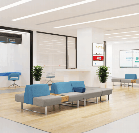 Small modular coffee tables arranged in a creative office breakout space