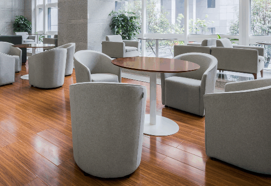 Modern factory floor producing high-end office desks and ergonomic chairs