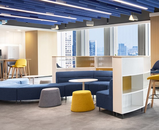 Professional consultant reviewing furniture floor plans for a government agency