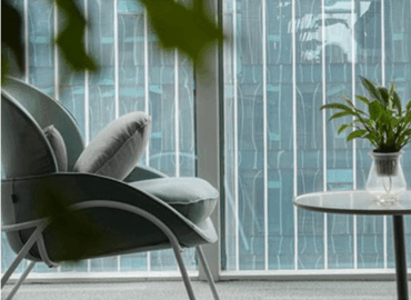 Modern conference room furniture featuring integrated technology for hybrid meetings