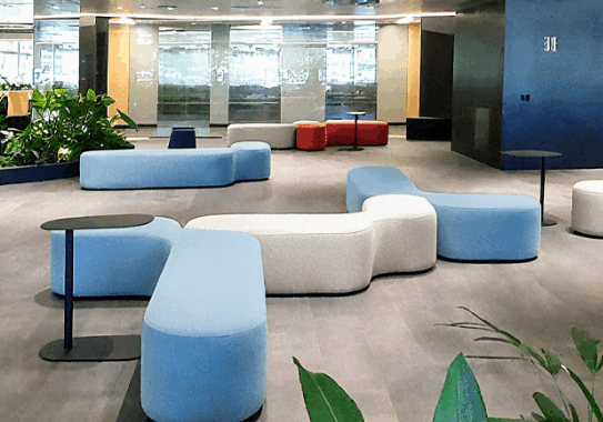 Modern office furniture showroom in China featuring ergonomic workstations