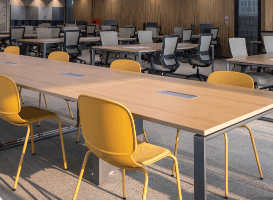 Modern office interior with sleek white desks and ergonomic chairs