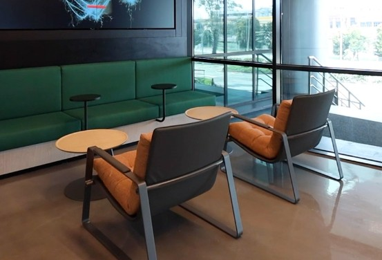Modern outdoor office setup with weather resistant desk and chair on a sunny terrace