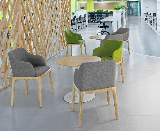 Modern office space featuring sustainable wood desks and ergonomic recycled chairs
